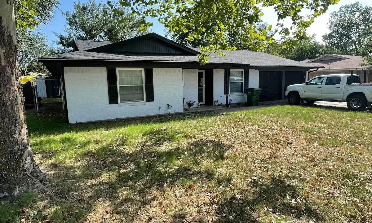 Professional roofing crew working on a residential roof in Fruitland
